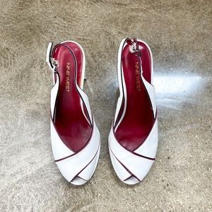 Vintage white leather peep-toe Nine West with red pipe detail.